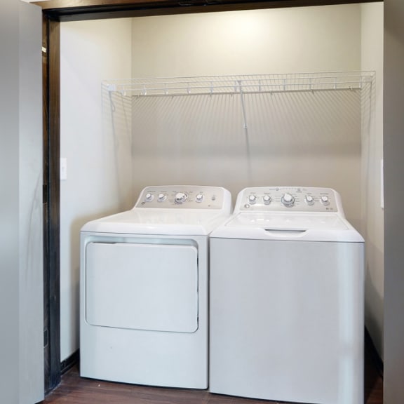 Thumbnail 8 of 10 washer dryer pair in closet with shelving for storage