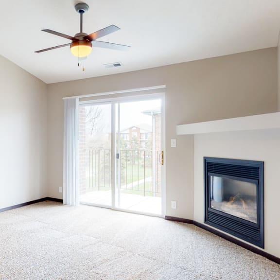 Thumbnail 5 of 10 Renovated living room with high ceilings and gas fireplace at Northridge Heights in Lincoln
