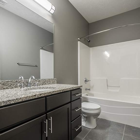 Thumbnail 8 of 11 Bathroom with spacious vanity for storage and granite counters