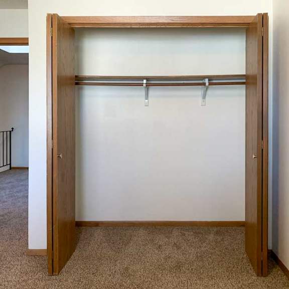 Thumbnail 27 of 30 a closet with built-in shelf and hanging space