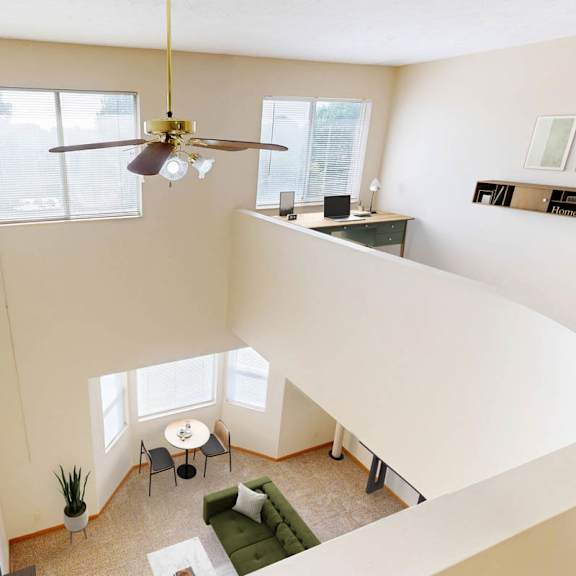 Thumbnail 37 of 40 View of a living room looking down from a lofted bedroom