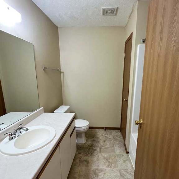 Thumbnail 13 of 13 a bathroom with a sink, shower, and closet