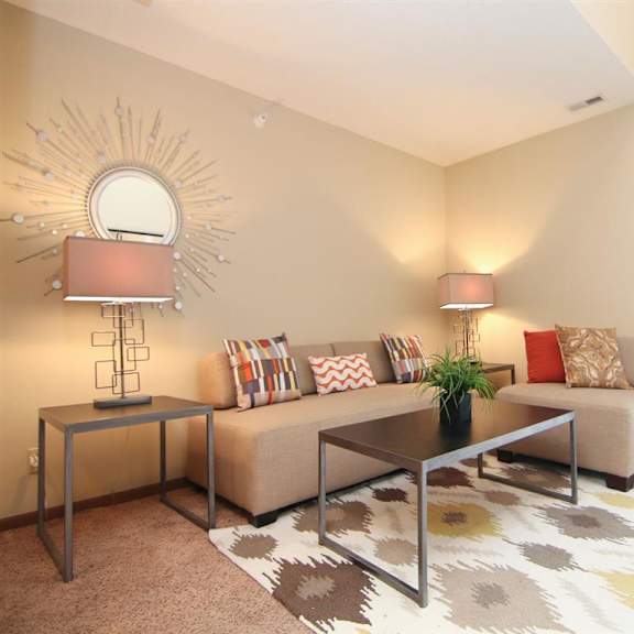 Thumbnail 3 of 13 Living room furnished with a couch, side table, rug and lamps