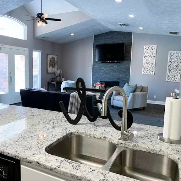 a kitchen with a sink and a counter top