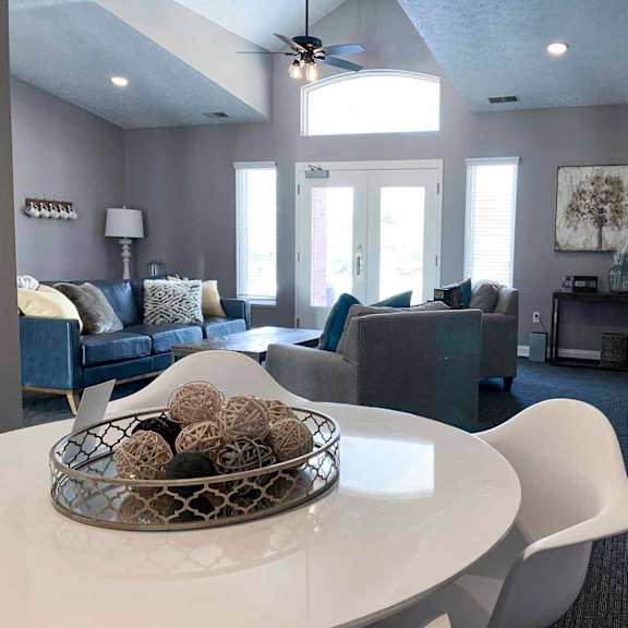 apartment clubhouse with a white table and chairs