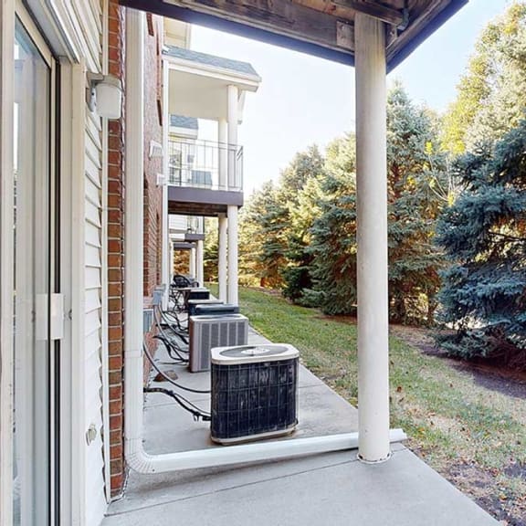 Thumbnail 13 of 20 a patio with a view of a nature area and trail