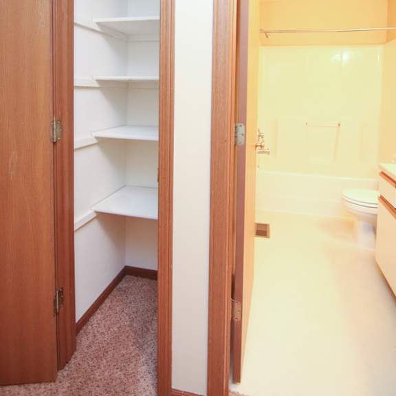 Thumbnail 13 of 13 Linen closet with storage shelves next to the bathroom