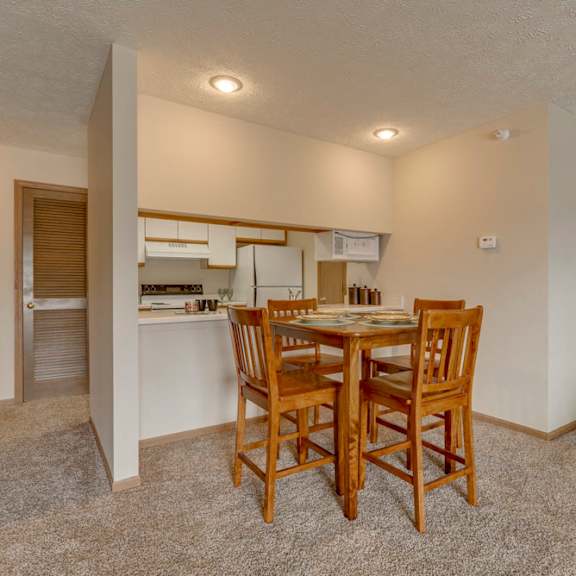 Thumbnail 6 of 15 Dining area and kitchen view at Pine Lake Heights Apartments