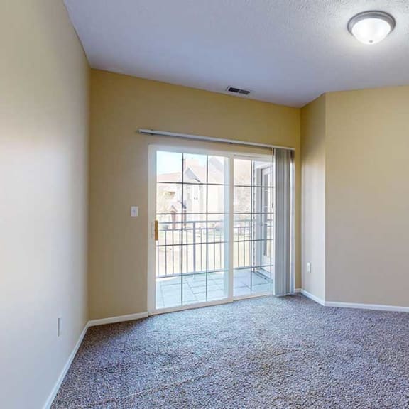 Thumbnail 15 of 28 the primary bedroom with a sliding door leading to the balcony