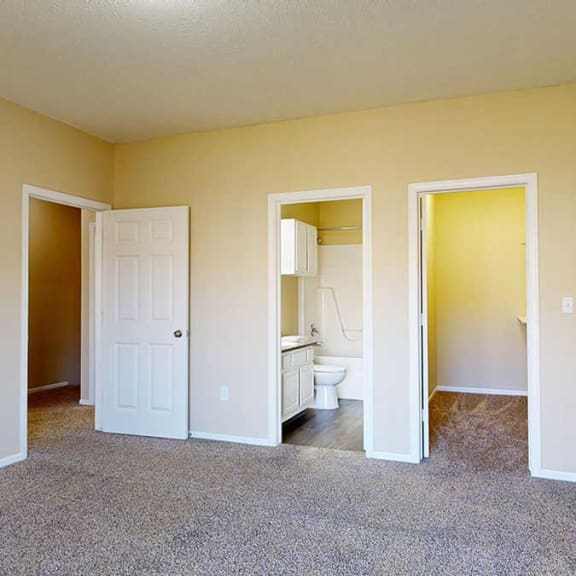 Thumbnail 16 of 28 a primary bedroom with walk-in closet and attached bathroom