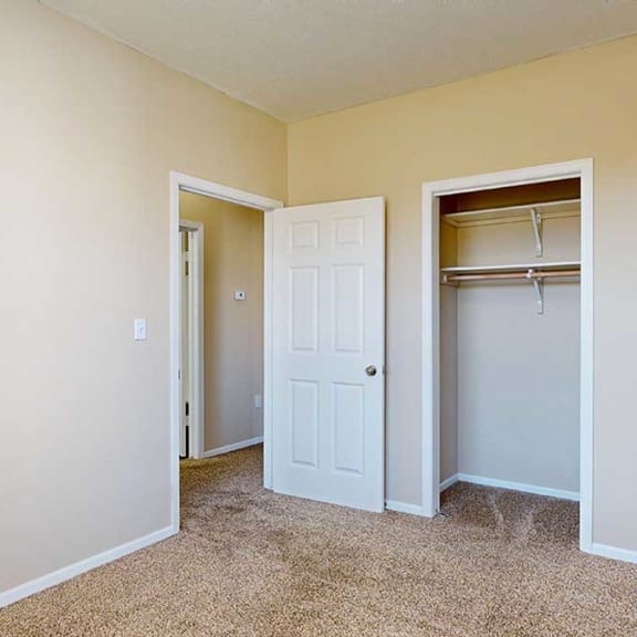 Thumbnail 20 of 28 a bedroom with a wide walk-in closet