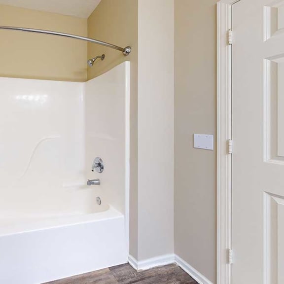 Thumbnail 23 of 28 a bathroom with a combo tub shower