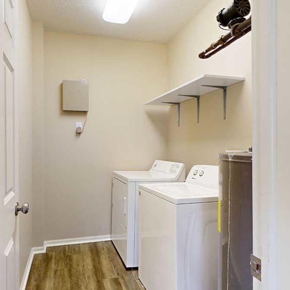 Thumbnail 27 of 28 a laundry room with a full-sized washer and dryer with overhead shelving