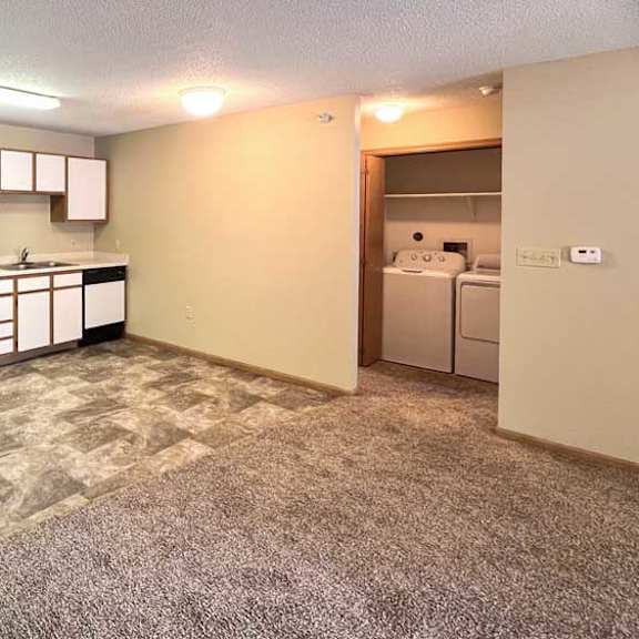 Thumbnail 6 of 11 a kitchen with white cabinets and appliances