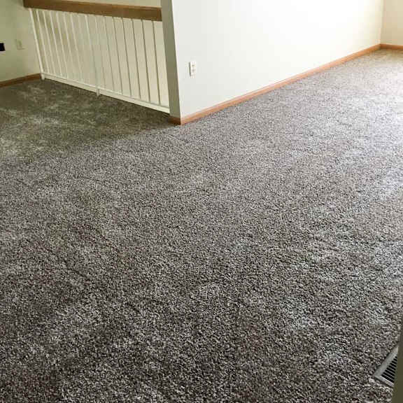Thumbnail 9 of 11 a loft area with carpeted flooring and a railing