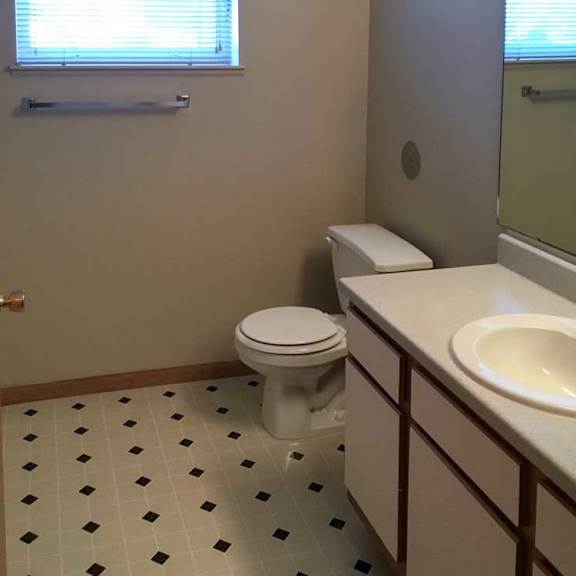 Thumbnail 9 of 11 a bathroom with a vanity sink and a mirror