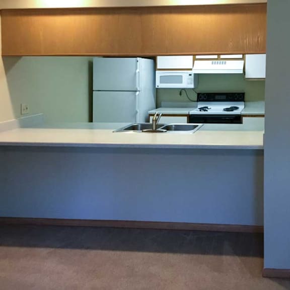 Thumbnail 3 of 11 a kitchen with a windowed countertop for dining seating