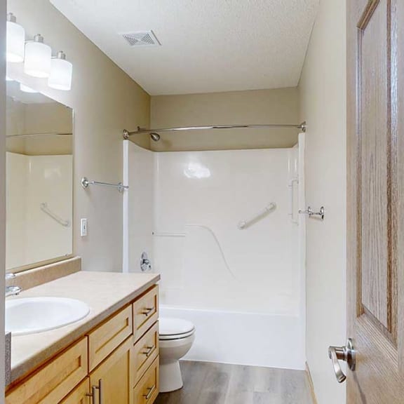 Thumbnail 23 of 26 a bathroom with a sink and a toilet and a shower tub