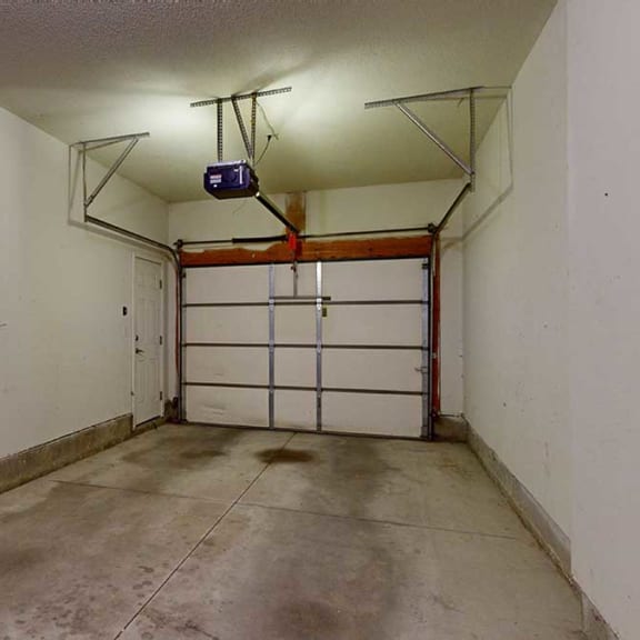 Thumbnail 26 of 26 a tandem garage with overhead lights