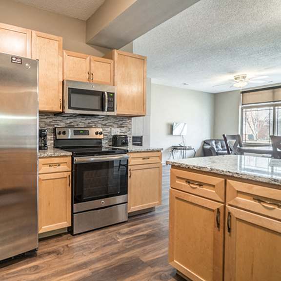 Thumbnail 7 of 21 Upgraded unit with side-by-side stainless steel fridge and appliances at Southwind Villas townhomes in La Vista, NE, 68128
