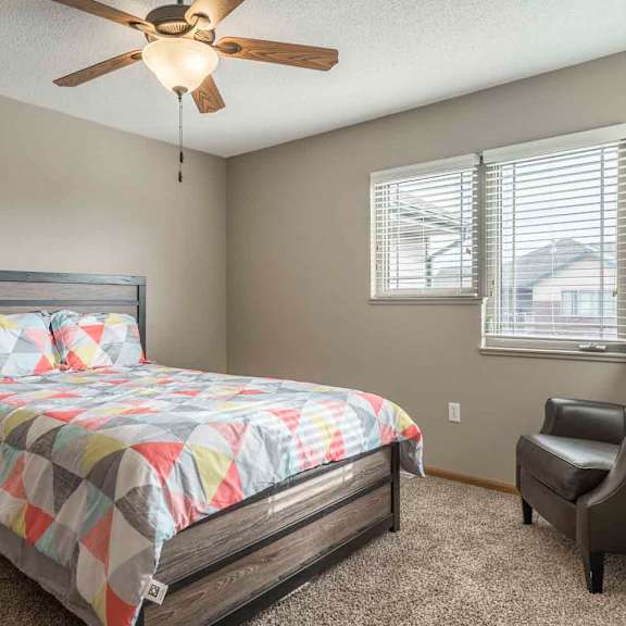 Thumbnail 15 of 21 Second bedroom with ceiling fan at Southwind Villas in southwest Omaha in La Vista, NE, 68128
