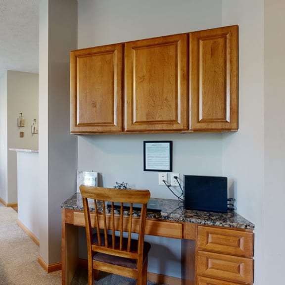Thumbnail 3 of 19 built in desk workspace with dining area in background