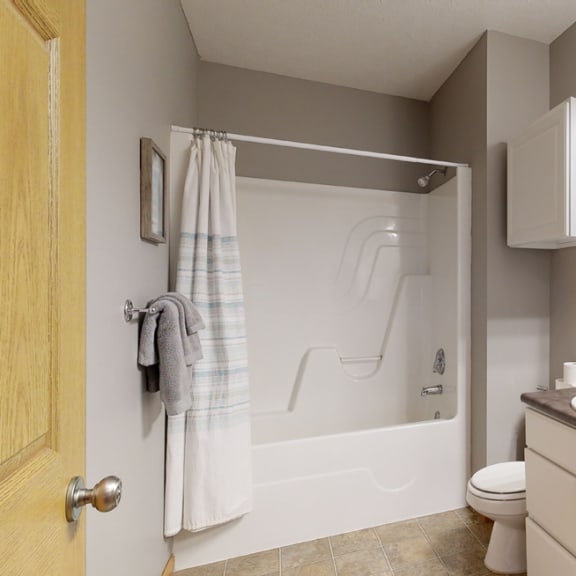 Thumbnail 18 of 19 a bathroom with a sink and a shower and a toilet