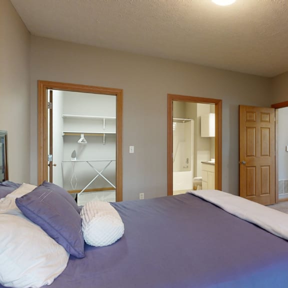 Thumbnail 16 of 19 a master bedroom with walk in closet and private bath