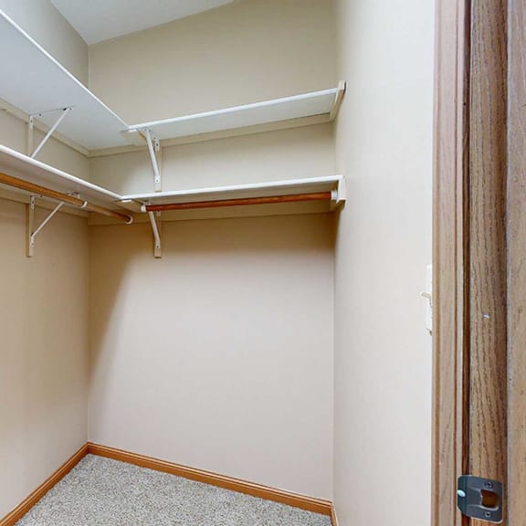 Thumbnail 19 of 28 a walk in closet with built-in shelves and hanging space