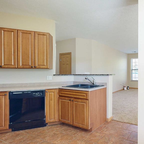 Thumbnail 10 of 28 a kitchen with a pantry door next to a window