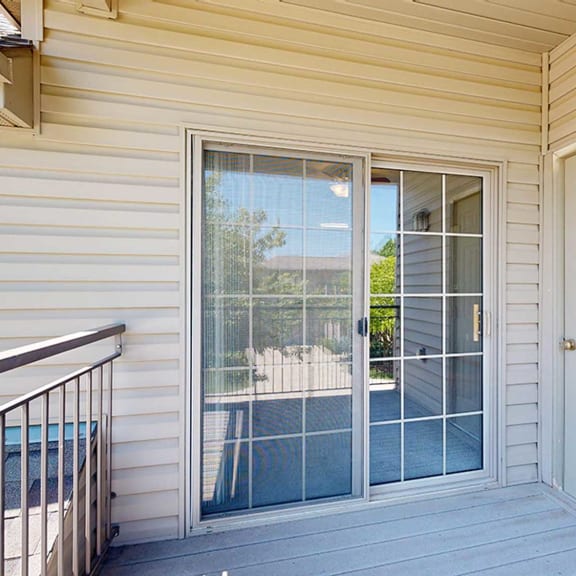Thumbnail 11 of 24 a balcony with outdoor storage closet and sliding glass door
