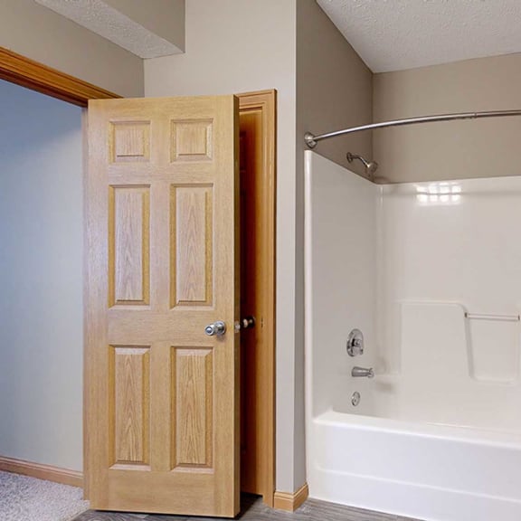 Thumbnail 20 of 24 a bathroom with a shower tub and mechanical closet