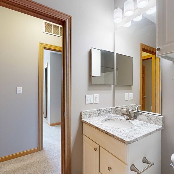 Thumbnail 13 of 24 a bathroom with a granite countertop sink and a mirror