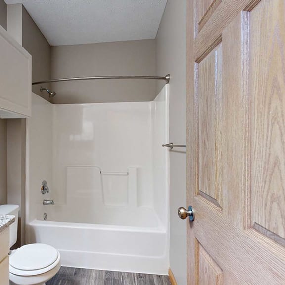 Thumbnail 14 of 24 a bathroom with a shower tub and a sink and a toilet