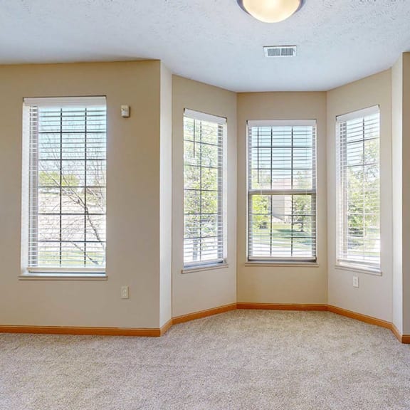 Thumbnail 6 of 32 a living room with a bay window dining space