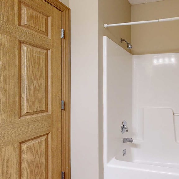Thumbnail 29 of 32 a bathroom with a shower and a bath tub
