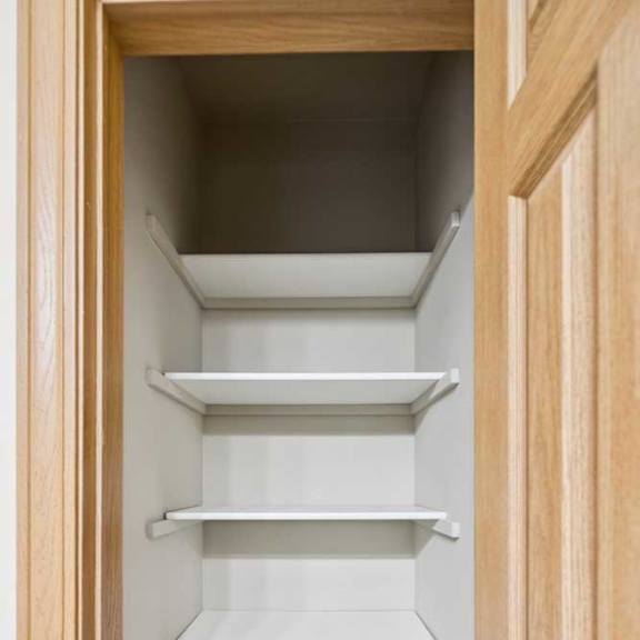 Thumbnail 19 of 19 A white pantry with shelves and a tile floor.