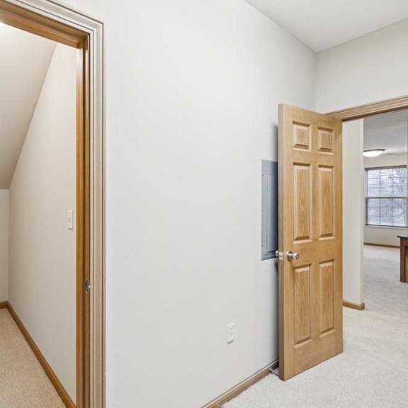 Thumbnail 12 of 20 Utility/storage room with mechanical access panel and additional interior storage space.