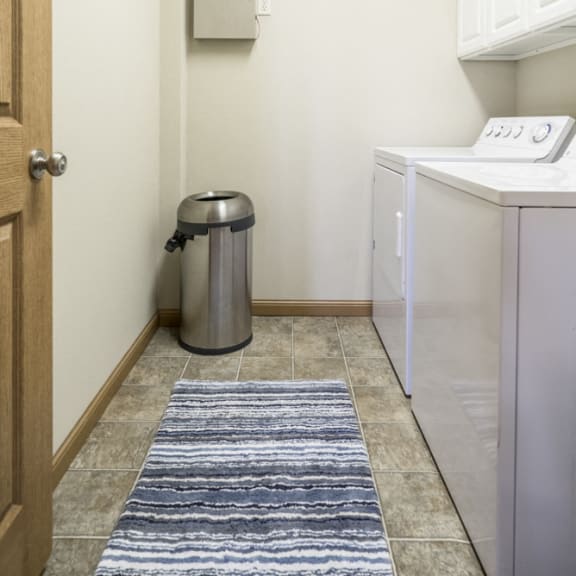 Thumbnail 8 of 12 Separate laundry room with full-size washer and dryer included at Stone Ridge townhomes in south Lincoln NE