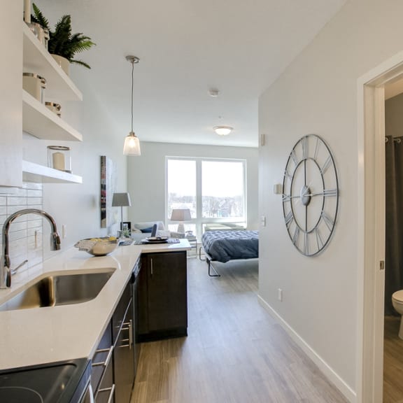 Thumbnail 10 of 11 Kitchen with white subway tile at The Central apartments near downtown Minneapolis MN 55408