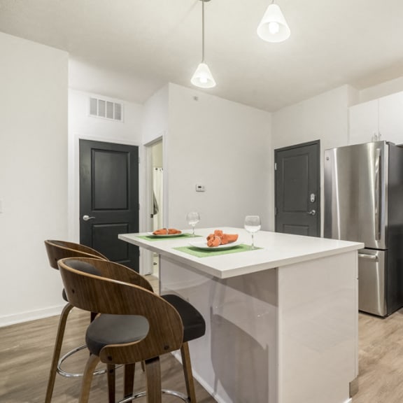 Thumbnail 3 of 9 1 bedroom apartment with white cabinets and stainless steel appliances near UNMC in Omaha's Blackstone District