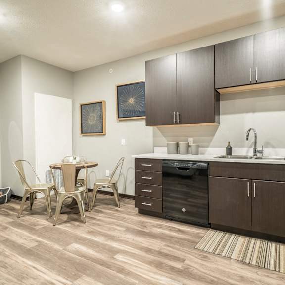 Thumbnail 4 of 11 Pet-friendly apartment with dark cabinetry at The Conrad in the Blackstone District in Omaha