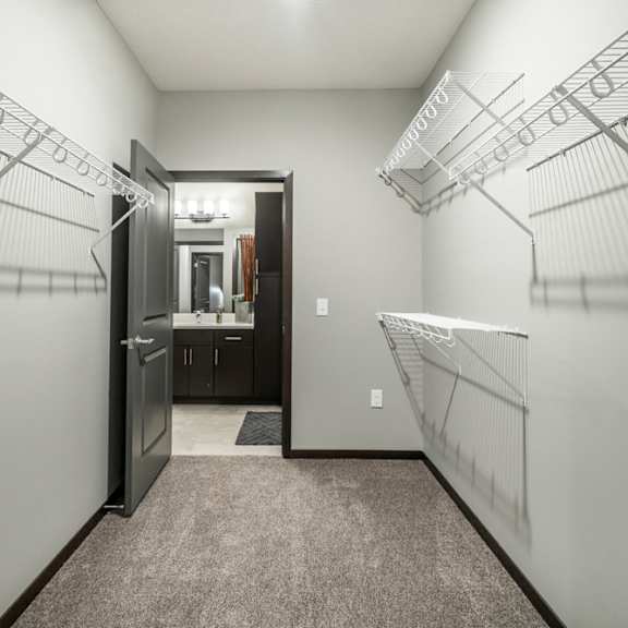 Thumbnail 9 of 11 Spacious walk-in closet at The Conrad apartments in midtown Omaha NE