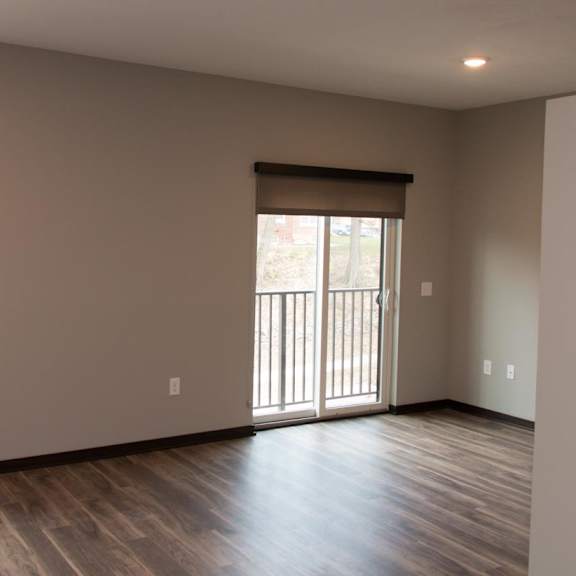 Thumbnail 2 of 6 Studio living space with window and sliding glass door