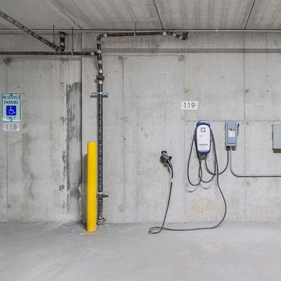 an ev charging station located in the parking garage