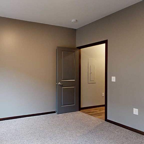 Thumbnail 14 of 21 a bedroom with carpeted flooring, grey walls, and a large window with a granite windowsill