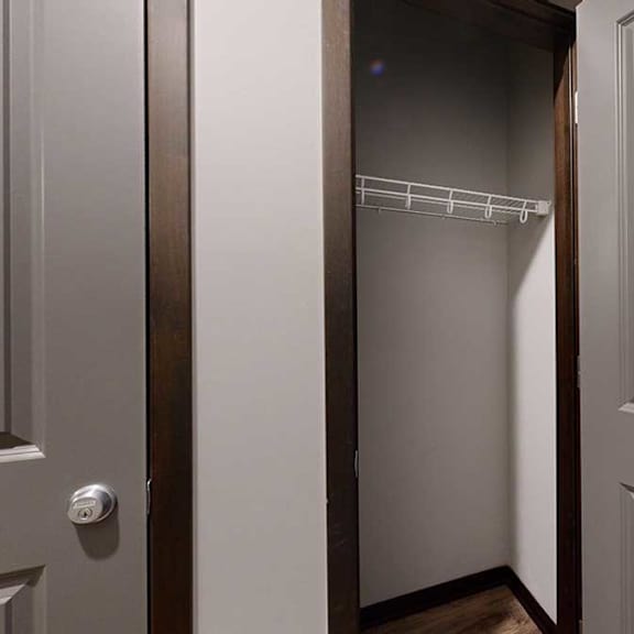 Thumbnail 13 of 21 a hallway coat closet with built-in shelving and hanging space