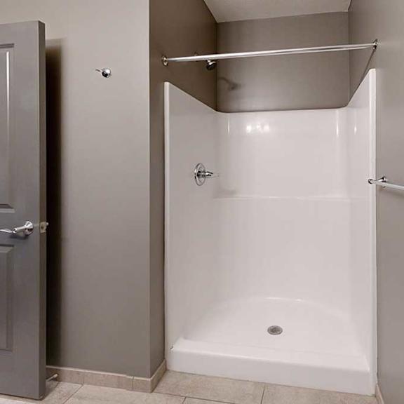 Thumbnail 17 of 17 a bathroom with a walk in shower and a towel rack
