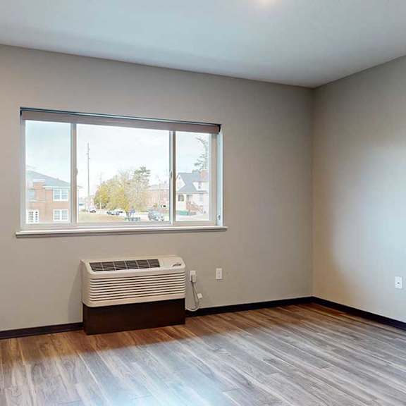 Thumbnail 8 of 17 a kitchen and living room with a large window