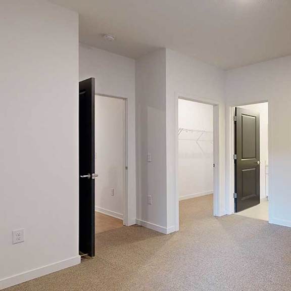 Thumbnail 8 of 28 a large bedroom with an attached bath and walk in closet